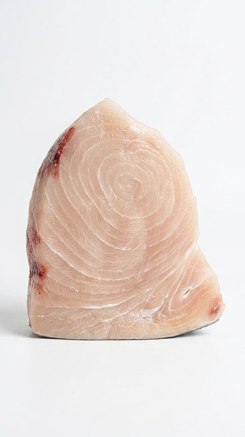 Raw swordfish steak with bloodline on white — Pelican Seafood Fort Pierce